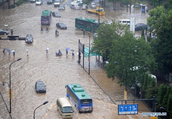 Photo taken on Oct. 8, 2013 shows a waterlogged intersection in Hangzhou, capital of east China's Zhejiang Province. The continuous rainfall brought by Typhoon Fitow caused waterlog in some areas of Hangzhou. (Xinhua/Ju Huanzong) 