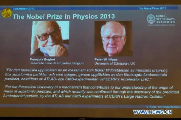 Pictures of Belgium's scientist Francois Englert (L) and British scientist Peter Higgs are projected on a screen as Staffan Normark (not in photo), permanent Secretary of the Royal Swedish Academy of Sciences, announces the laureates of the 2013 Nobel Prize in Physics during a press conference in Stockholm, Sweden, on Oct. 8, 2013. The 2013 Nobel Prize in Physics went to Francois Englert from Belgium and British scientist Peter Higgs, announced the Royal Swedish Academy of Sciences in Stockholm on Tuesday. (Xinhua/Shi Tiansheng)