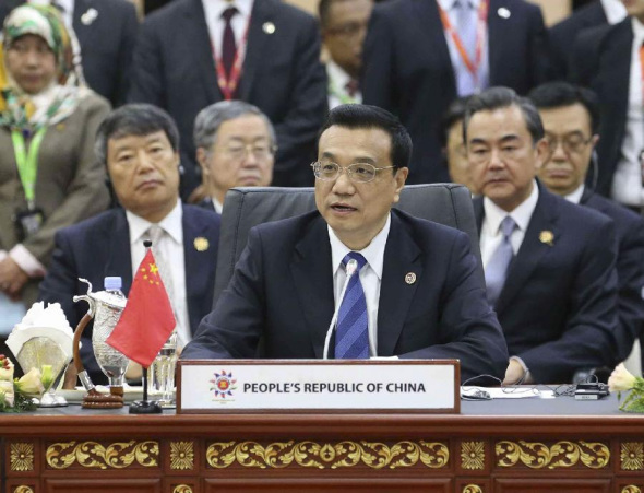 Chinese Premier Li Keqiang speaks at the 16th Association of Southeast Asian Nations (ASEAN) Plus Three Summit (APT) in Bandar Seri Begawan, Brunei, Oct. 10, 2013. (Xinhua/Liu Weibing)
