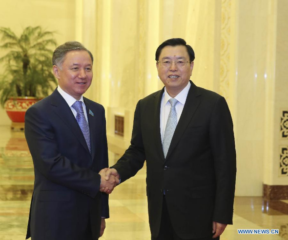 Zhang Dejiang (R), chairman of the Standing Committee of China's National People's Congress (NPC), holds talks with Nurlan Nigmatulin, speaker of the Kazakh Parliament's Lower House, at the Great Hall of the People in Beijing, capital of China, Oct. 15, 2013. (Xinhua/Ding Lin)