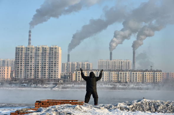 An elderly man exercises on the side of Songhua River in the heavily polluted city of Jilin, Jilin province, on Feb 24. Heng Guoliang / For China Daily
