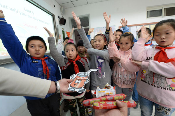 Speaking English is the focus of a class in Beijing on Wednesday. Liu Chang / for China Daily
