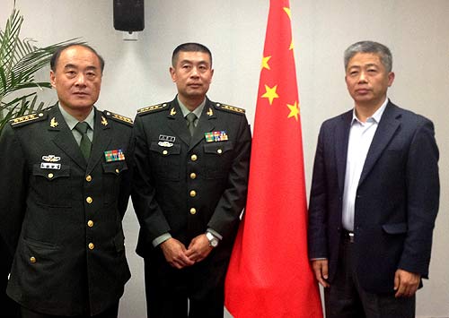 From left: Zhang Guohua and Guo Jianzeng, chemical warfare experts in the People's Liberation Army, and Yang Jianguo, a chemical engineer, start two weeks' preparation on Monday for duties in Syria. MO JINGXI / CHINA DAILY