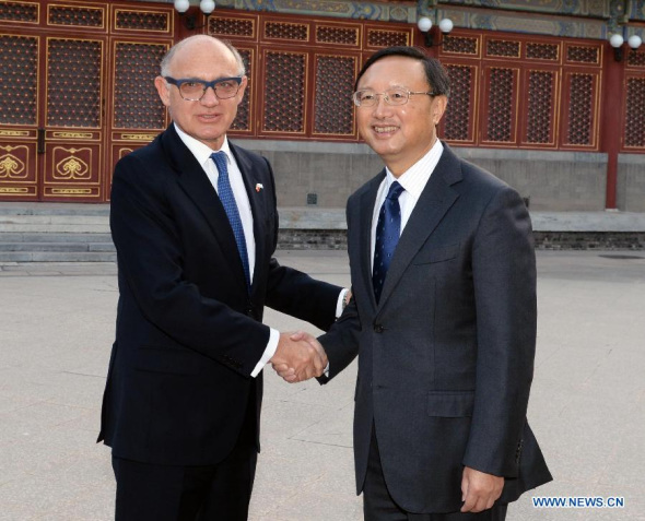 Chinese State Councilor Yang Jiechi (R) shakes hands with Argentine Foreign Minister Hector Timerman, who is here to attend the Shanghai International Arts Festival, during their meeting in Beijing, capital of China, Nov. 7, 2013. (Xinhua/Li Tao)