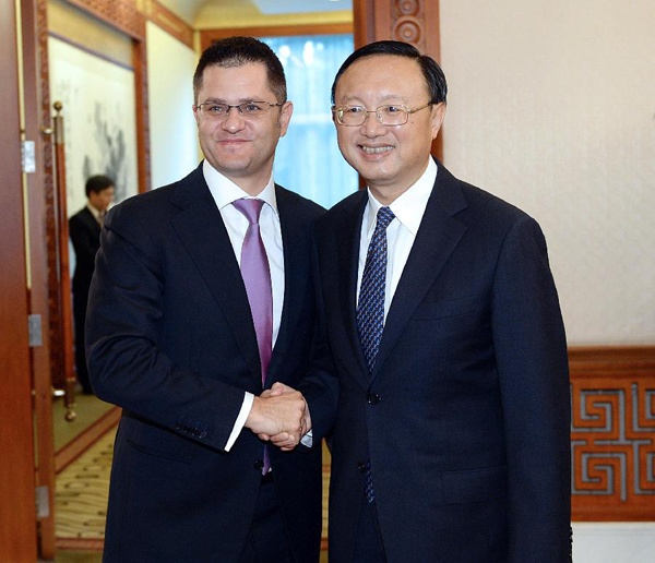 Chinese State Councilor Yang Jiechi (R) shakes hands with Vuk Jeremic, president of the 67th Session of the UN General Assembly (UNGA) and former Serbian foreign minister, during their meeting in Beijing, capital of China, Nov. 8, 2013. (Xinhua/Li Tao)
