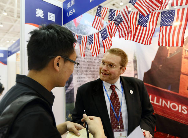 A student gets advice about studying in the United States during the Beijing International Education Exhibition. More and more Chinese students have headed to the US for undergraduate and graduate study in recent years. A Jing / For China Daily