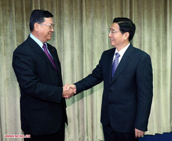 Chinese State Councilor and Minister of Public Security Guo Shengkun (R) shakes hands with visiting Myanmar Minister of Home Affairs Lieutenant-General Ko Ko during a China-Myanmar minister-level meeting on bilateral cooperation in law enforcement and security, in Beijing, capital of China, Nov. 13, 2013. (Xinhua/Li Tao)