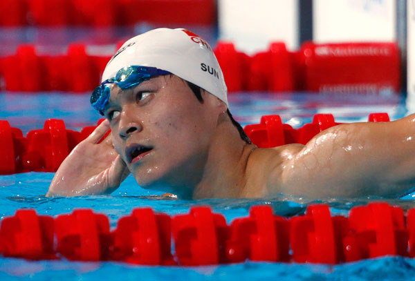 China's Sun Yang reacts after the men's 1500m freestyle heats during the World Swimming Championships at the Sant Jordi arena in Barcelona in this August 3, 2013 file photo. [Photo/Agencies]