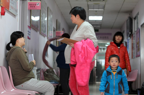 Pregnant women wait to see a doctor at the Beijing Obstetrics and Gynecology Hospital on Sunday. Zhang Yujun / For China Daily