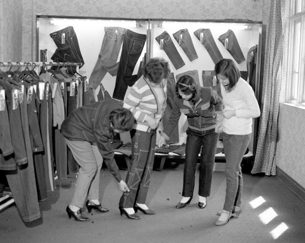 This 1987 photo shows clothing workers in Tianjin trying on jeans for export.