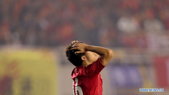 Huang Bowen of China reacts during their AFC Asian Cup 2015 qualifiers football match between China and Saudi Arabia in Xi'an city, capital of northwest China's Shaanxi Province, On Nov. 19, 2013. The match ended in a 0-0 draw. (Xinhua/Cao Can) 