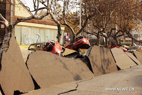 Photo taken on Nov. 22, 2013 shows the site of a pipeline explosion in Qingdao, east China's Shandong Province. At least 35 people were killed and 166 others injured after a leaking pipeline caught fire and exploded on Friday morning in the coastal city of Qingdao. (Xinhua)