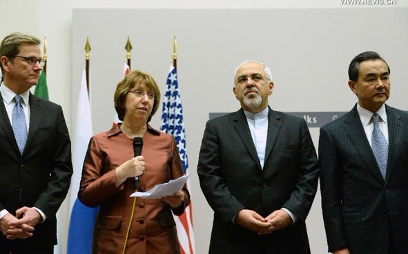 EU foreign policy chief Catherine Ashton (2nd L) delivers a statement in Geneva, Switzerland, Nov. 24, 2013. After intensive negotiations, the P5+1 group and Iran have reached a first-step agreement on Iran's nuclear program, EU foreign policy chief Catherine Ashton announced early Sunday morning. (Xinhua/Wang Siwei)