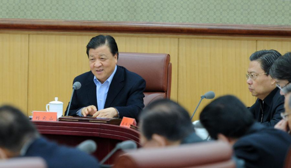 Liu Yunshan (L), a Standing Committee member of the Political Bureau of the Communist Party of China (CPC) Central Committee and head of the CPC's campaign to strengthen the mass line, presides over a symposium attended by 16 inspection team leaders from organs of the CPC Central Committee and government in Beijing, capital of China. Nov. 24, 2013. The CPC in June initiated the year-long campaign to strengthen the mass line, referring to a guideline under which the CPC is required to prioritize the interests of the people. (Xinhua/Zhang Duo)