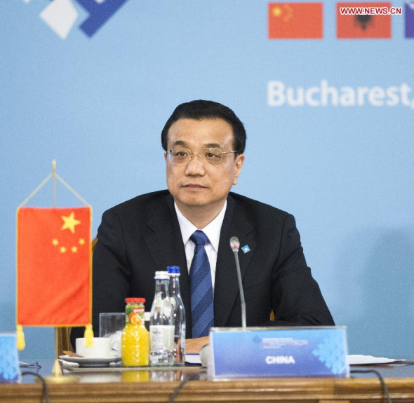 Chinese Premier Li Keqiang attends the leaders meeting of China and countries in Central and Eastern Europe (CEE) in Bucharest, Romania, Nov. 26, 2013. (Xinhua/Li Xueren) 