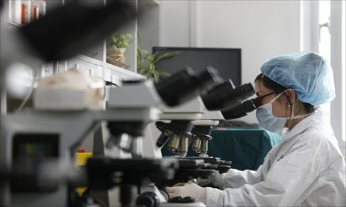A sperm bank doctor analyses a sample in the Renji Hospital laboratory. Photo: Cai Xianmin/GT