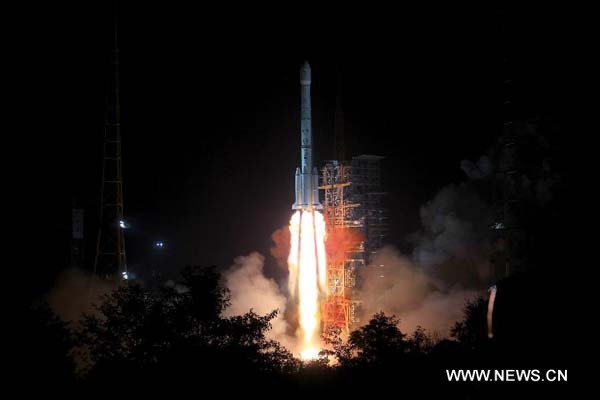 The Long March-3B carrier rocket carrying China's Chang'e-3 lunar probe blasts off from the launch pad at Xichang Satellite Launch Center, southwest China's Sichuan Province, Dec. 2, 2013. It will be the first time for China to send a spacecraft to soft land on the surface of an extraterrestrial body, where it will conduct surveys on the moon. (Xinhua/Li Gang)