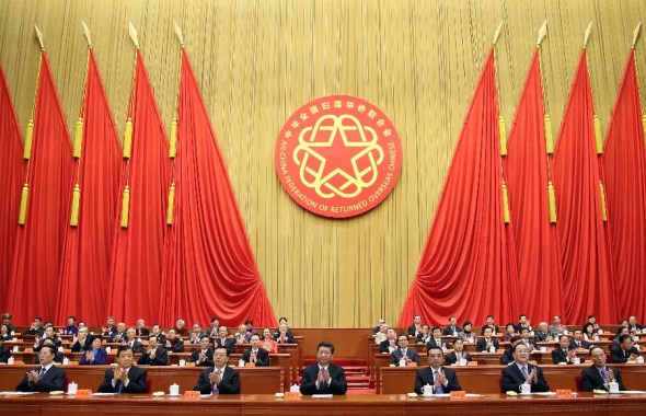 Top Chinese leaders Xi Jinping (C front), Li Keqiang (3rd R front), Zhang Dejiang (3rd L front), Yu zhengsheng (2nd R front), Liu Yunshan (2nd L front), Wang Qishan (1st R front), and Zhang Gaoli (1st L front) attend the opening ceremony of the ninth national congress of returned overseas Chinese and their relatives at the Great Hall of the People in Beijing, capital of China, Dec. 2, 2013.(Xinhua/Lan Hongguang) 