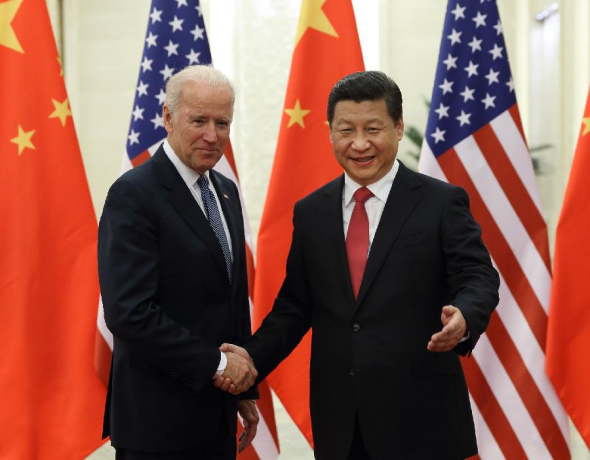 Chinese President Xi Jinping (R) shakes hands with US Vice President Joe Biden during their meeting at the Great Hall of the People in Beijing, capital of China, Dec. 4, 2013. (Xinhua/Lan Hongguang)