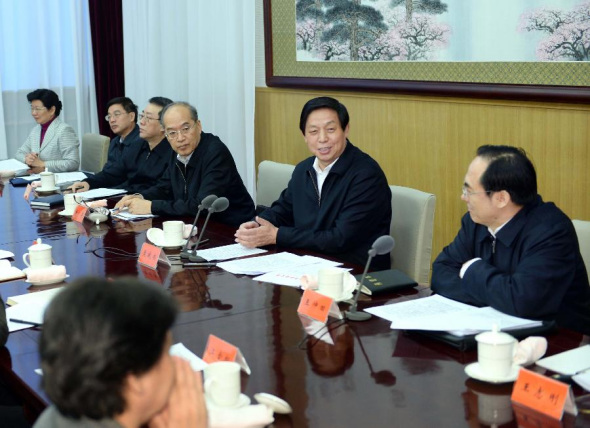 Li Zhanshu (2nd R), a member of the Political Bureau of the Communist Party of China (CPC) Central Committee and director of the General Office of the CPC Central Committee, addresses a meeting on Party rules in Beijing, capital of China, Dec. 4, 2013. (Xinhua/Li Tao) 