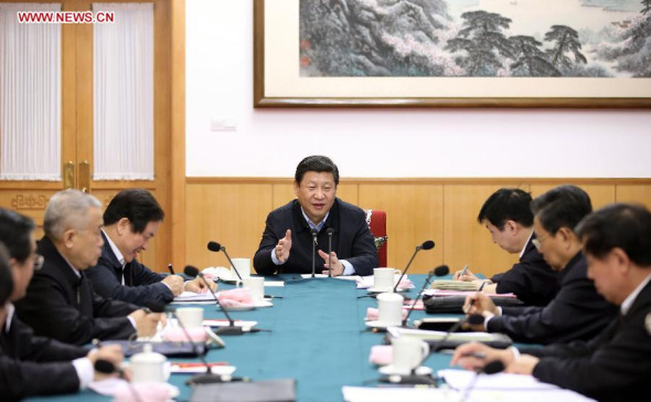 Chinese President XiJinping (C), also general secretary of the Communist Party of China(CPC) Central Committee, participates in a session as part of theongoing mass line campaign with members of the Party Committee ofnorth China's Hebei Province, in Beijing, capital of China, Dec. 9,2013. (Xinhua/Lan Hongguang)