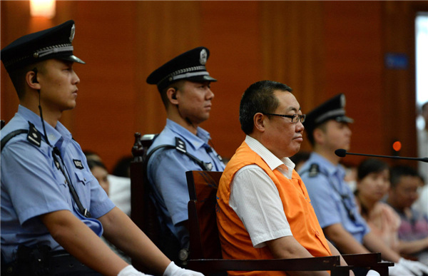 Yang Dacai, former head of the Shaanxi provincial work safety administration, stands bribery trial at Xi'an City Intermediate People's Court, Aug 30, Northwest China's Shaanxi province. Yang drew public outrage last summer after a news photo showing him smiling at the site of a deadly highway crash went viral online. [Photo/Xinhua]