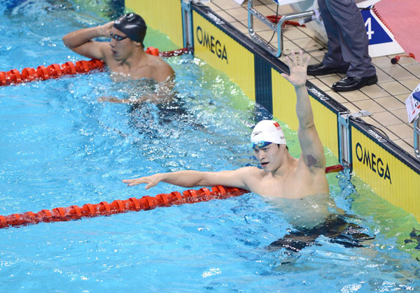 Sun Yang of Zhejiang province celebrates after winning the men's 1,500-meter freestyle final at the 12th Chinese National Games, in Shenyang, Liaoning province, Sept 11, 2013. [Photo/Xinhua]