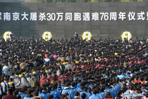 People attend a memorial ceremony at the Memorial Hall of the Victims in Nanjing Massacre by Japanese Invaders in Nanjing, capital of east China's Jiangsu Province, Dec. 13, 2013, to mark the 76th anniversary of the Nanjing Massacre. Nanjing was occupied on Dec. 13, 1937, by Japanese troops who began a six-week massacre. Records show more than 300,000 Chinese unarmed soldiers and civilians were killed. (Xinhua/Han Yuqing)