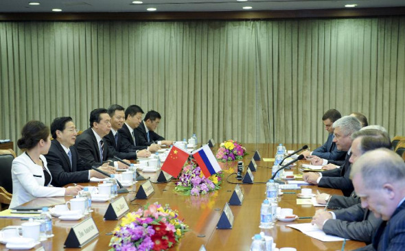 Chinese State Councilor and Minister of Public Security Guo Shengkun holds talks with Russian Minister of Internal Affairs Vladimir Kolokoltsev in Beijing, capital of China, Dec. 16, 2013. (Xinhua/Zhang Duo)