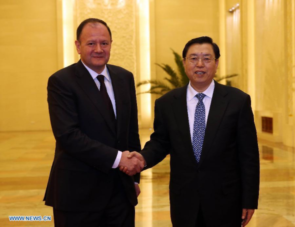 Zhang Dejiang (R), chairman of the Standing Committee of the National People's Congress (NPC), holds talks with Bulgarian Parliament Speaker Mihail Mikov in Beijing, capital of China, Dec. 16, 2013. (Xinhua/Liu Weibing)