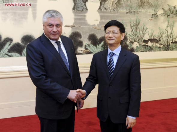 Meng Jianzhu (R), a member of the Political Bureau of the Communist Party of China Central Committee and also secretary of the Commission for Political and Legal Affairs of the Communist Party of China Central Committee, shakes hands with Russian Minister of Internal Affairs Vladimir Kolokoltsev during their meeting in Beijing, capital of China, Dec. 16, 2013.(Xinhua/Zhang Duo)