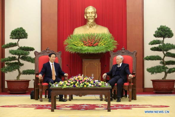 Wang Jiarui (L), vice chairman of the National Committee of the Chinese People's Political Consultative Conference and head of the International Department of the Communist Party of China (CPC) Central Committee, meets with General Secretary of the Communist Party of Vietnam (CPV) Nguyen Phu Trong in Vietnam's capital Hanoi, Dec. 19, 2013. (Xinhua/Ho Nhu Y)