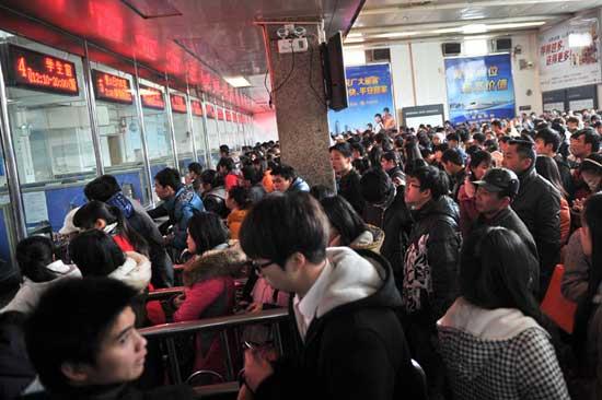 Passengers buy train tickets for Spring Festival travel.