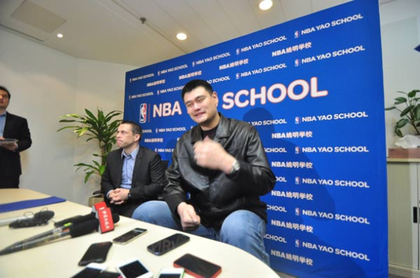 Former NBA All Star Yao Ming (right) and NBA China CEO David Shoemaker answer questions during an interview after the NBA Yao School's New Year Celebration. [Photo by Sun Xiaochen / chinadaily.com.cn]