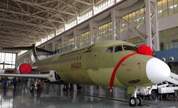 One of the pair of Chinas first domestically produced regional jets, the 90-seat ARJ-21, at a hangar of the Commercial Aircraft Corp of China in Baoshan district on Monday afternoon. The jets are assembled in Shanghai and will be delivered next year. 