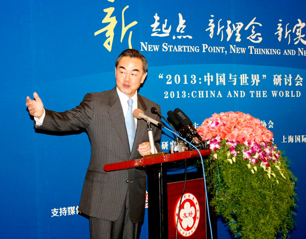 Foreign Minister Wang Yi attends a seminar that reviewed Chinas foreign policies in the past year in Beijing on Dec 16. JIN LIDONG / CHINA NEWS SERVICE