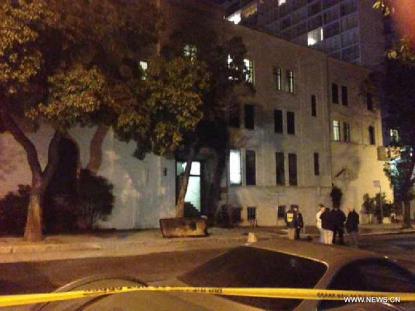 The photo taken by mobile phone in the early morning of Jan. 2, 2014, shows the Chinese Consulate-General in San Francisco, the United States. The Chinese Consulate-General in San Francisco was burnt by arsonists on Jan. 1 and the front gate was severely damaged. (Xinhua/Xu Yong)