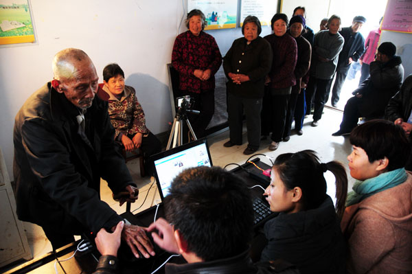 Biological information is collected from retirees, all older than 60 years, in Linyi, Shandong province in November. The information will be used in the future to confirm their identities more quickly. Fang Dehua / for China Daily