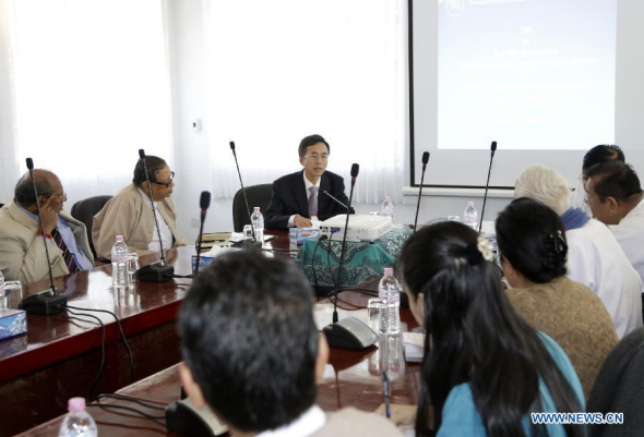 Chinese Ambassador to Myanmar Yang Houlan (3rd L, back) delivers a speech during his visit to Myanmar Institute for Strategic and International Studies (MISIS) in Yangon, Myanmar, Jan. 9, 2014. (Xinhua/U Aung)