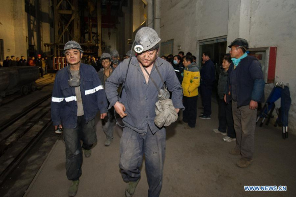 Trapped workers in a coal mine accident leave the shaft after being lifted in Huainan City, east China's Anhui Province, Jan. 14, 2014. By far, 21 trapped miners had been lifted safely and another one died, according to the Huainan Mining Industry Co., Ltd., a state-owned group of the Zhuji coal mine. (Xinhua/Du Yu)