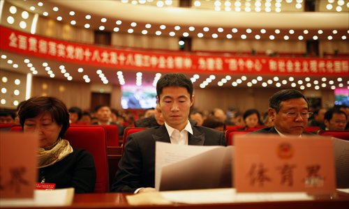 Wang Liqin (middle), a former Chinese table tennis world champion, and other members of the Shanghai Committee of the Chinese People's Political Consultative Conference (CPPCC) attend the first day of this year's meeting Saturday. The annual Shanghai CPPCC meeting runs until Wednesday. The Shanghai Municipal People's Congress will run until Thursday. Photo: Cai Xianmin/GT