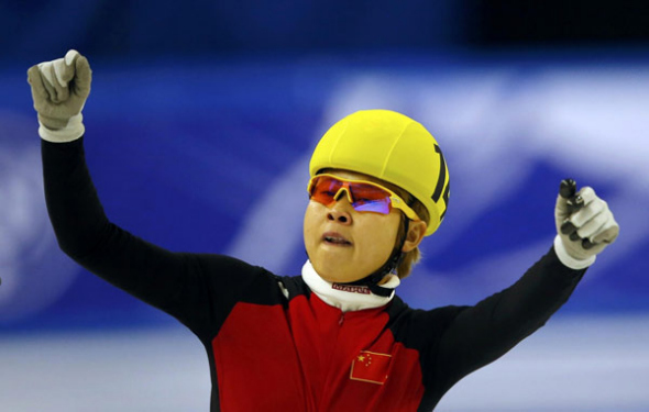 Wang Meng of China celebrates as she won the women's 1000m final at the ISU World Short Track Speed Skating Championships in Debrecen March 10, 2013. [File photo]