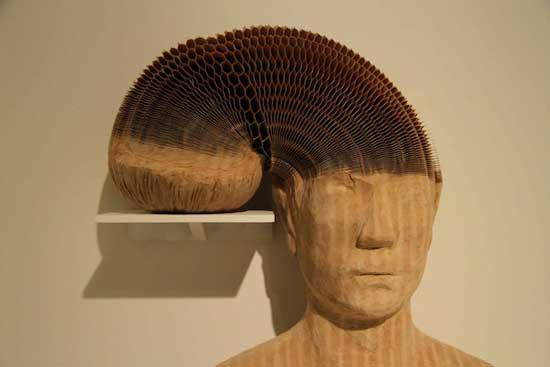 38-year-old Chinese artist places his hands on one, lifts gently, and what had seemed like solid plaster transforms into a live, amorphous mass. A Roman soldier stretches like elastic, a pretty English maid suddenly rises like a terrible phantasm. They are neither plaster nor clay, but concertinas of thousands of fine pieces of paper.