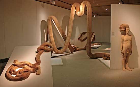 38-year-old Chinese artist places his hands on one, lifts gently, and what had seemed like solid plaster transforms into a live, amorphous mass. A Roman soldier stretches like elastic, a pretty English maid suddenly rises like a terrible phantasm. They are neither plaster nor clay, but concertinas of thousands of fine pieces of paper.