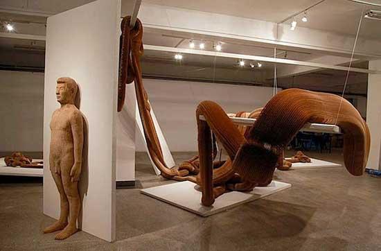 38-year-old Chinese artist places his hands on one, lifts gently, and what had seemed like solid plaster transforms into a live, amorphous mass. A Roman soldier stretches like elastic, a pretty English maid suddenly rises like a terrible phantasm. They are neither plaster nor clay, but concertinas of thousands of fine pieces of paper.