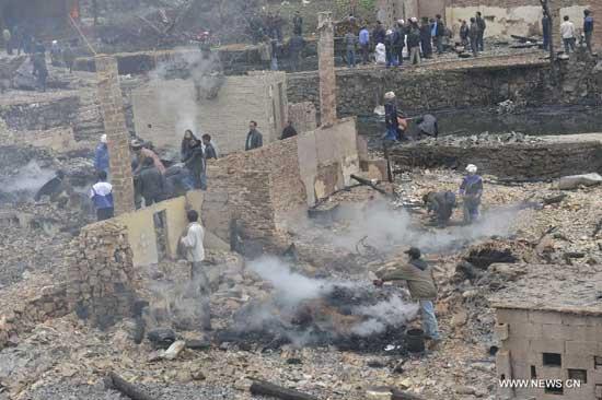 A fire broke out at 11:30 p.m. on Saturday in the village and destroyed more than 100 houses. Baojing Dong Village, built 300 years ago, is the biggest Dong village in Qiandongnan Miao and Dong Autonomous Prefecture of Guizhou. It was one of China's most well-preserved such settlements, known for its ancient Dong-style dwellings. It holds 470 households and nearly 2,000 inhabitants. No casualties have been reported and the cause of the fire is being investigated. (Xinhua/Li Lin)