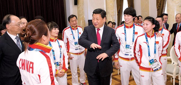 President Xi Jinping shares a light moment with some Chinese athletes attending the Winter Olympics in Sochi, Russia, on Friday. Huang Jingwen / Xinhua 