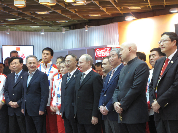 Russian president Vladimir Putin visits China House at the Sochi Winter Olympic Games on February 10, 2014. [Photo by Lei Lei/China Daily]   