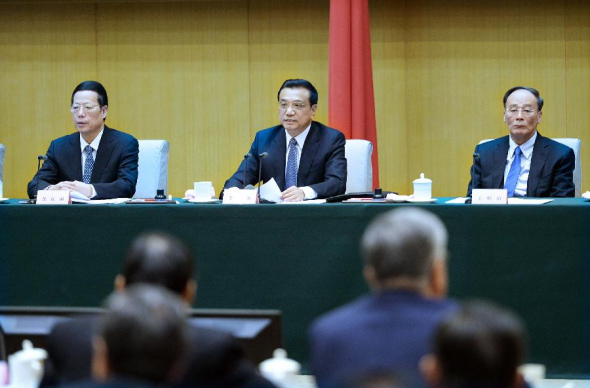 Chinese Premier Li Keqiang (C), also a member of the Standing Committee of the Political Bureau of the Communist Party of China (CPC) Central Committee, speaks during the second anti-corruption work conference held by the State Council in Beijing, Feb 11, 2014. (Xinhua/Li Tao) 