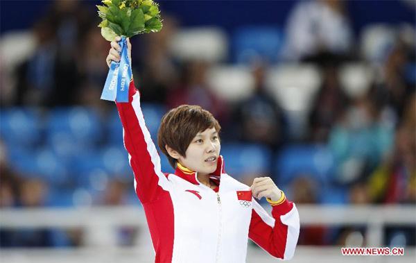 Li Jianrou claimed China's first gold medal in the Sochi Winter Olympic Games on Thursday as she won the women's 500m short track speed skating final which saw the other three skaters crash at the beginning. (Xinhua)